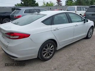 2017 Ford Fusion SE z VIN 3FA6P0H71HR413635, wystawiony jako IAAI lot #42507386 z przebiegiem 165 991 mil mil oraz . Historia ofert i sprzedaży dostępna na DreamBid. Obrazek 4.