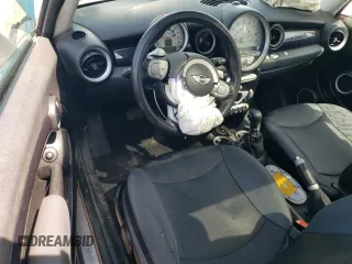 2009 MINI Hardtop with VIN WMWMF33569TW74610, listed as a Copart auction lot 54889805 with 147,533 mi miles and Salvage Title. Bid and sale history available at DreamBid. Image 8.