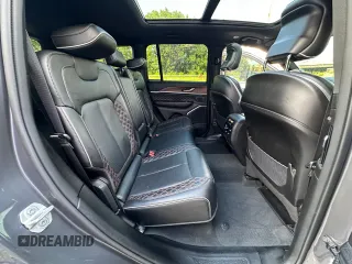 2023 Jeep Grand Cherokee Summit with VIN 1C4RJHEG2P8882566, listed as a Copart auction lot 65095905 with 59,970 mi miles and Salvage title. Bid and sale history available at DreamBid. Image 6.
