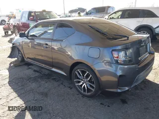 2016 Scion tC with VIN JTKJF5C78GJ014184, listed as a IAAI auction lot 41622575 with 128,520 mi miles. Bid and sale history available at carsss.com. Image 3.