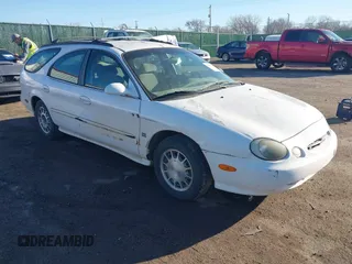 1999 Ford Taurus SE z VIN 1FAFP58SXXG191894, wystawiony jako IAAI lot #41628348 z przebiegiem 168 299 mil mil oraz . Historia ofert i sprzedaży dostępna na DreamBid. Obrazek 1.