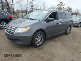 2012 Honda Odyssey EX-L with VIN 5FNRL5H65CB042898, listed as a IAAI auction lot 41784075 with 179,596 mi miles and . Bid and sale history available at carsss.com. Image 2.