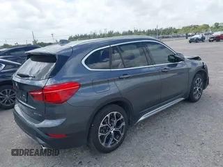 2022 BMW X1 sDrive28i with VIN WBXJG7C00N5U59675, listed as a IAAI auction lot 41915231 with 34,983 mi miles. Bid and sale history available at carsss.com. Image 4.