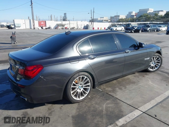 2015 BMW 7 Series 750Li with VIN WBAYE8C52FD780902, listed as a IAAI auction lot 40808265 with 102,774 mi miles. Bid and sale history available at carsss.com. Image 4.