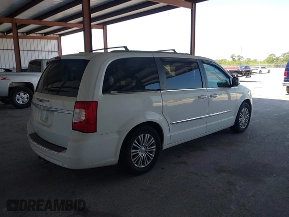 2014 Chrysler Town & Country Touring-L with VIN 2C4RC1CG2ER312444, listed as a IAAI auction lot 42050774 with 124,010 mi miles. Bid and sale history available at carsss.com. Image 4.