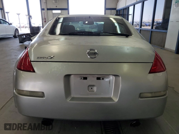 2003 Nissan 350Z Touring с VIN JN1AZ34D03T114076, выставлен на аукционе Copart как лот 61078255 с пробегом 187 952 миль миль и Списание • Salvage title. История ставок и продаж доступна на DreamBid. Изображение 6.