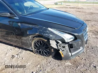 2014 Cadillac CTS Luxury AWD z VIN 1G6AX5SX9E0177017, wystawiony jako IAAI lot #42038429 z przebiegiem 113 656 mil mil oraz . Historia ofert i sprzedaży dostępna na DreamBid. Obrazek 6.