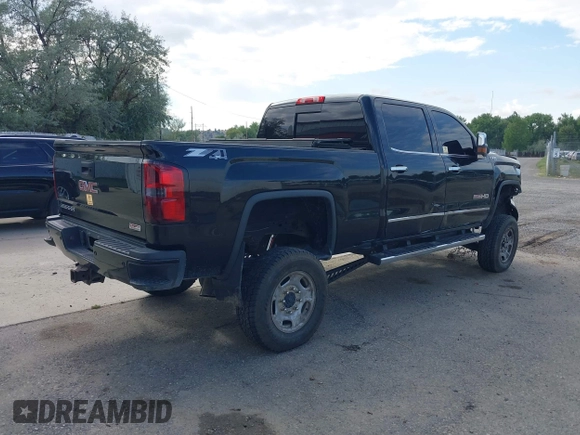 2015 GMC Sierra 2500HD SLT with VIN 1GT12ZE87FF552599, listed as a IAAI auction lot 40054977 with 146,190 mi miles and . Bid and sale history available at DreamBid. Image 4.