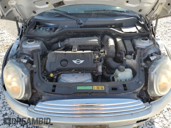 2007 MINI Hardtop z VIN WMWMF33557TL77261, wystawiony jako Copart lot #52651125 z przebiegiem 129 752 mil mil oraz Szkoda całkowita • Salvage title. Historia ofert i sprzedaży dostępna na DreamBid. Obrazek 11.