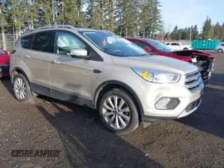 2017 Ford Escape Titanium with VIN 1FMCU0JD0HUB79739, listed as a IAAI auction lot 41807975 with 121,902 mi miles. Bid and sale history available at carsss.com. Image 1.