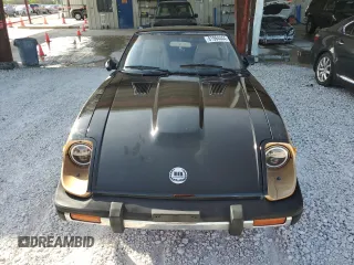 1980 Datsun 280ZX z VIN HS130221335, wystawiony jako Copart lot #81964444 z przebiegiem 135 266 mil mil oraz Szkody całkowita. Historia ofert i sprzedaży dostępna na DreamBid. Obrazek 5.