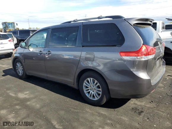 2014 Toyota Sienna XLE with VIN 5TDYK3DC8ES457727, listed as a Copart auction lot 77224224 with 121,879 mi miles and Salvage Title. Bid and sale history available at carsss.com. Image 2.