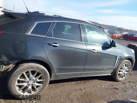 2014 Cadillac SRX Premium Collection z VIN 3GYFNDE34ES581728, wystawiony jako IAAI lot #41578226 z przebiegiem 121 118 mil mil oraz . Historia ofert i sprzedaży dostępna na DreamBid. Obrazek 14.
