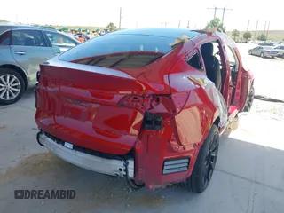 2020 Tesla Model Y Long Range with VIN 5YJYGDEE0LF029496, listed as a IAAI auction lot 41977695 with 47,958 mi miles and . Bid and sale history available at DreamBid. Image 4.