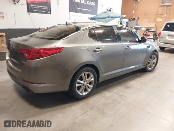 2013 Kia Optima EX with VIN 5XXGN4A74DG165525, listed as a IAAI auction lot 42405482 with 132,820 mi miles and . Bid and sale history available at DreamBid. Image 4.