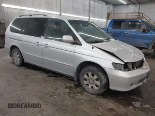2004 Honda Odyssey EX-L z VIN 5FNRL18944B130748, wystawiony jako IAAI lot #41457307 z przebiegiem 283 101 mil mil oraz . Historia ofert i sprzedaży dostępna na DreamBid. Obrazek 1.