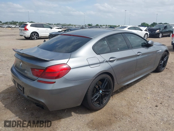 2014 BMW 6 Series 650i z VIN WBA6B2C55ED128934, wystawiony jako IAAI lot #42070641 z przebiegiem 102 597 mil mil oraz . Historia ofert i sprzedaży dostępna na DreamBid. Obrazek 4.