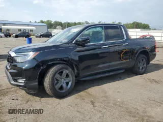 2022 Honda Ridgeline RTL-E with VIN 5FPYK3F7XNB023787, listed as a Copart auction lot 66883515 with 49,786 mi miles and Salvage title. Bid and sale history available at DreamBid. Image 1.