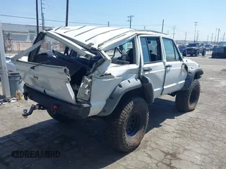 1991 Jeep Cherokee Country z VIN 1J4FJ78S7ML632675, wystawiony jako IAAI lot #42283175 z przebiegiem 116 062 mil mil oraz . Historia ofert i sprzedaży dostępna na DreamBid. Obrazek 6.
