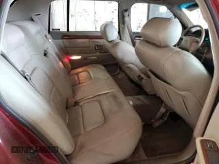 1998 Cadillac DeVille z VIN 1G6KD54Y3WU754718, wystawiony jako Copart lot #60068175 z przebiegiem 64 498 mil mil oraz Czysty tytuł • Clean title. Historia ofert i sprzedaży dostępna na DreamBid. Obrazek 10.