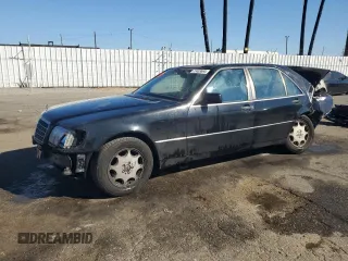 1994 Mercedes-Benz S with VIN WDBGA51E2RA184222, listed as a Copart auction lot 77403664 with 109,428 mi miles and Salvage Title. Bid and sale history available at DreamBid. Image 1.