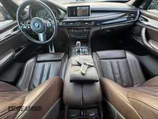 2018 BMW X5 xDrive50i z VIN 5UXKR6C53J0U15144, wystawiony jako Copart lot #58630945 z przebiegiem 204 714 mil mil oraz Tytuł czysty. Historia ofert i sprzedaży dostępna na DreamBid. Obrazek 9.
