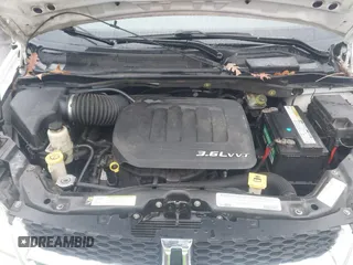2012 Dodge Grand Caravan SXT with VIN 2C4RDGCG4CR304472, listed as a IAAI auction lot 41396437 with 180,309 mi miles and . Bid and sale history available at DreamBid. Image 10.
