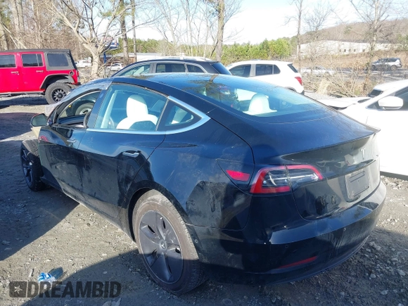 2019 Tesla Model 3 Mid Range z VIN 5YJ3E1EA4KF317872, wystawiony jako IAAI lot #41491269 z przebiegiem 90 772 mil mil oraz . Historia ofert i sprzedaży dostępna na DreamBid. Obrazek 13.