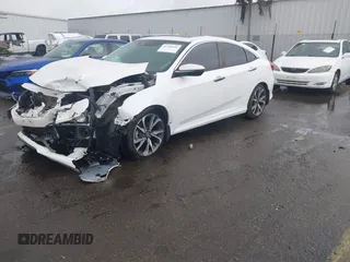 2020 Honda Civic Sedan Touring with VIN 19XFC1F91LE210390, listed as a IAAI auction lot 41766652 with 67,269 mi miles. Bid and sale history available at carsss.com. Image 2.