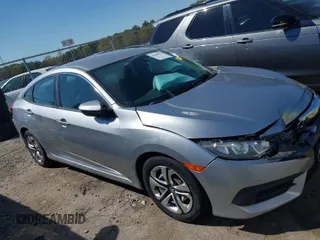 2017 Honda Civic LX z VIN 19XFC2F5XHE027936, wystawiony jako IAAI lot #41860102 z przebiegiem 94 278 mil mil oraz . Historia ofert i sprzedaży dostępna na DreamBid. Obrazek 1.