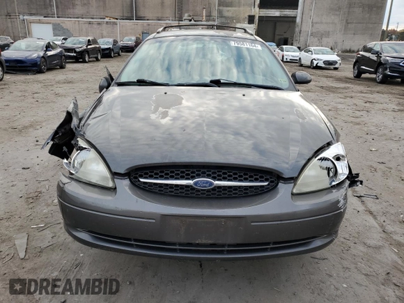 2002 Ford Taurus with VIN 1FAFP59S62A256119, listed as a Copart auction lot 79581164 with 57,128 mi miles and Clean title. Bid and sale history available at DreamBid. Image 5.