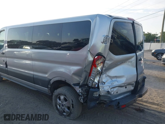 2018 Ford Transit Passenger XL with VIN 1FBZX2YM0JKA70128, listed as a IAAI auction lot 42379000 with 125,309 mi miles and . Bid and sale history available at DreamBid. Image 6.