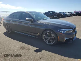 2019 BMW 5 Series M550i xDrive with VIN WBAJB9C57KB289036, listed as a Copart auction lot 86292134 with 28,103 mi miles and Salvage title. Bid and sale history available at DreamBid. Image 4.