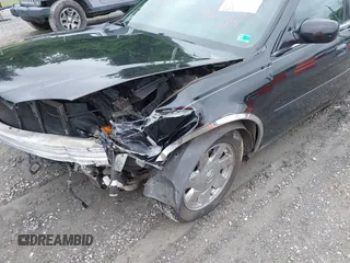 2002 Cadillac DeVille DTS z VIN 1G6KF579320288667, wystawiony jako IAAI lot #42331236 z przebiegiem 71 189 mil mil oraz . Historia ofert i sprzedaży dostępna na DreamBid. Obrazek 17.