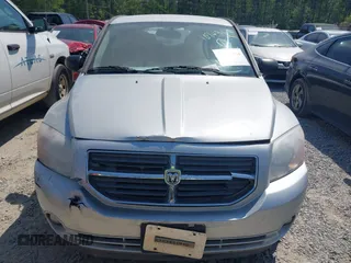 2011 Dodge Caliber Mainstreet with VIN 1B3CB3HAXBD107494, listed as a IAAI auction lot 42071328 with 146,936 mi miles. Bid and sale history available at carsss.com. Image 12.