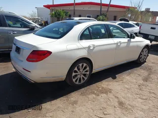 2019 Mercedes-Benz E-Class E 300 with VIN WDDZF4JBXKA597397, listed as a IAAI auction lot 41724672 with 99,258 mi miles. Bid and sale history available at carsss.com. Image 4.