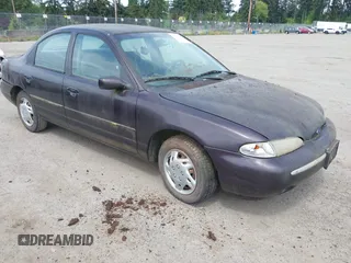 1995 Ford Contour z VIN 3FALP6633SM116313, wystawiony jako IAAI lot #42058920 z przebiegiem 192 905 mil mil oraz . Historia ofert i sprzedaży dostępna na DreamBid. Obrazek 1.