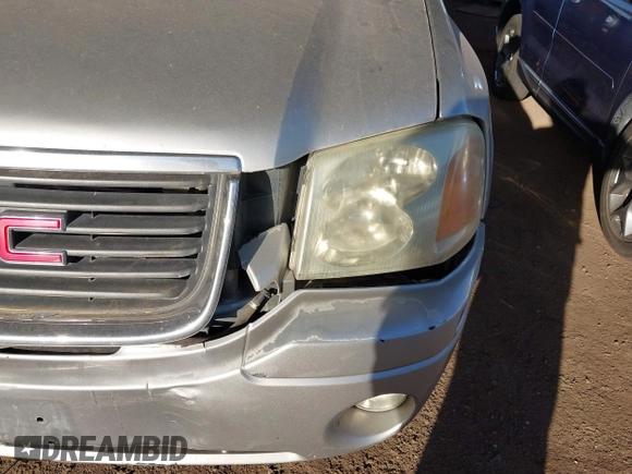 2004 GMC Envoy SLT with VIN 1GKDS13S942267554, listed as a IAAI auction lot 41754066 with 178,895 mi miles. Bid and sale history available at carsss.com. Image 6.