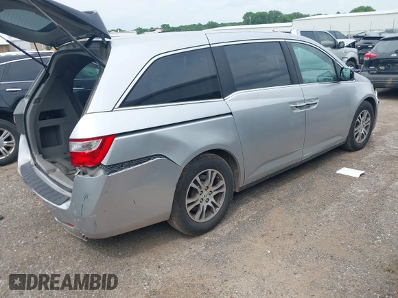 2012 Honda Odyssey EX-L with VIN 5FNRL5H66CB081323, listed as a IAAI auction lot 42465110 with 266,934 mi miles and . Bid and sale history available at DreamBid. Image 4.