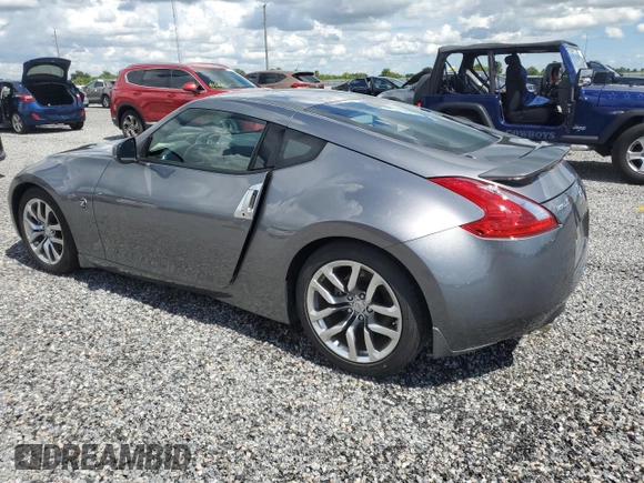 2014 Nissan 370Z with VIN JN1AZ4EH6EM633797, listed as a Copart auction lot 74027354 with Not Provided miles and Salvage Title. Bid and sale history available at DreamBid. Image 2.