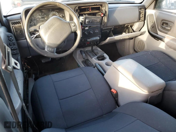 1998 Jeep Cherokee Country with VIN 1J4FT78S8XL520854, listed as a Copart auction lot 79304214 with 111,674 mi miles and Clean title. Bid and sale history available at DreamBid. Image 8.