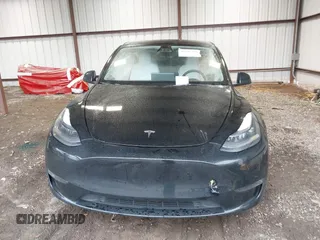 2023 Tesla Model Y Performance with VIN 7SAYGDEF2PF800641, listed as a IAAI auction lot 41612596 with 60,984 mi miles and . Bid and sale history available at DreamBid. Image 12.