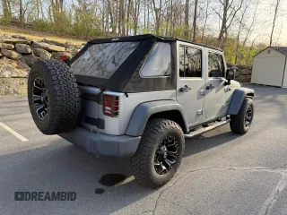 2014 Jeep Wrangler Unlimited Sport with VIN 1C4BJWDG0EL192509, listed as a Copart auction lot 54269205 with 50,701 mi miles and Clean Title. Bid and sale history available at carsss.com. Image 4.