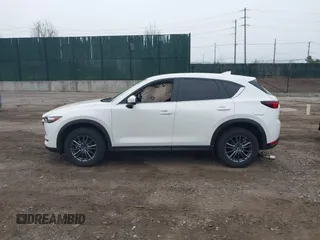 2021 Mazda CX-5 Touring with VIN JM3KFBCM1M1446313, listed as a IAAI auction lot 41930330 with 28,610 mi miles. Bid and sale history available at carsss.com. Image 14.