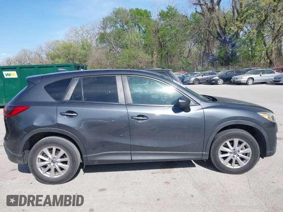 2016 Mazda CX-5 Touring z VIN JM3KE2CY4G0708972, wystawiony jako IAAI lot #42043013 z przebiegiem 157 573 mil mil oraz . Historia ofert i sprzedaży dostępna na DreamBid. Obrazek 13.