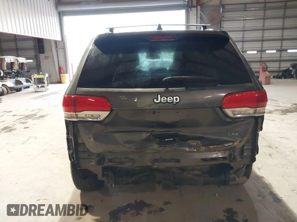 2014 Jeep Grand Cherokee Laredo with VIN 1C4RJEAG7EC145023, listed as a IAAI auction lot 40518825 with 115,098 mi miles and . Bid and sale history available at DreamBid. Image 16.