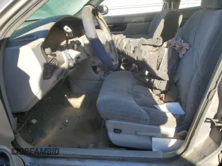 1999 Buick Regal LS with VIN 2G4WB52K8X1446410, listed as a Copart auction lot 74797294 with 0 mi miles and Salvage Title. Bid and sale history available at carsss.com. Image 7.