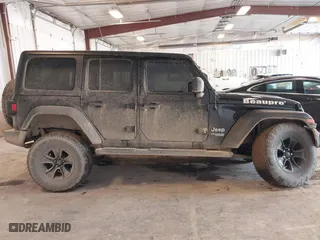 2020 Jeep Wrangler Unlimited Sport Altitude with VIN 1C4HJXDG4LW120627, listed as a IAAI auction lot 41728593 with 63,565 mi miles. Bid and sale history available at carsss.com. Image 13.