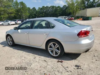 2014 Volkswagen Passat SE with VIN 1VWBT7A36EC047828, listed as a Copart auction lot 63711855 with 204,196 mi miles and Clean title. Bid and sale history available at DreamBid. Image 2.