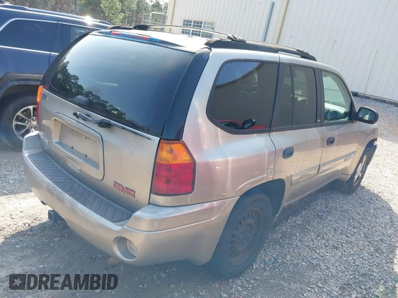 2003 GMC Envoy SLT z VIN 1GKDS13S932106295, wystawiony jako IAAI lot #41594814 z przebiegiem 199 597 mil mil oraz . Historia ofert i sprzedaży dostępna na DreamBid. Obrazek 4.